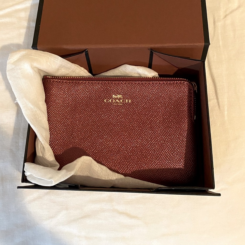 Coach polished pebble wristlet in wine NWT